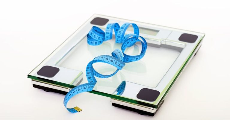 Weight - Blue Tape Measuring on Clear Glass Square Weighing Scale